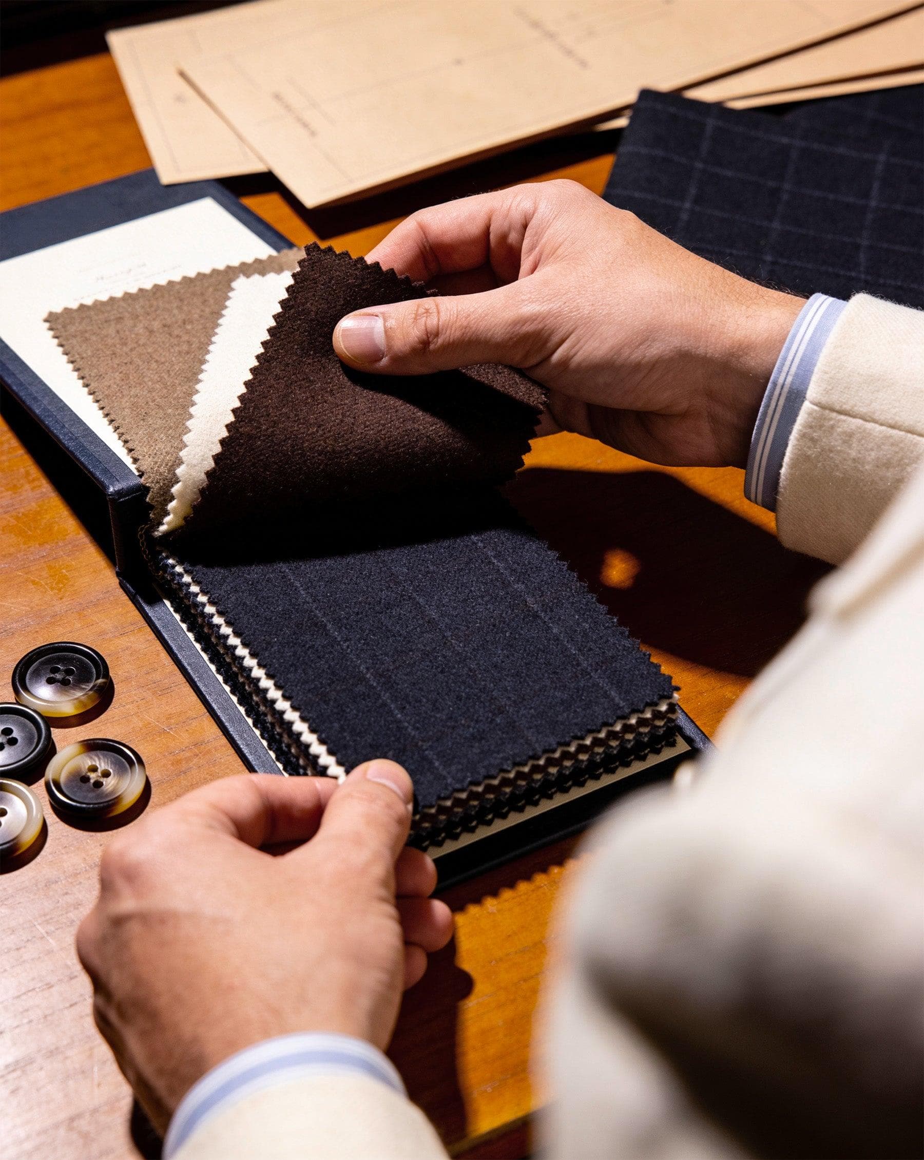 Curated fabric swatches and suiting cloths at Westbury atelier
