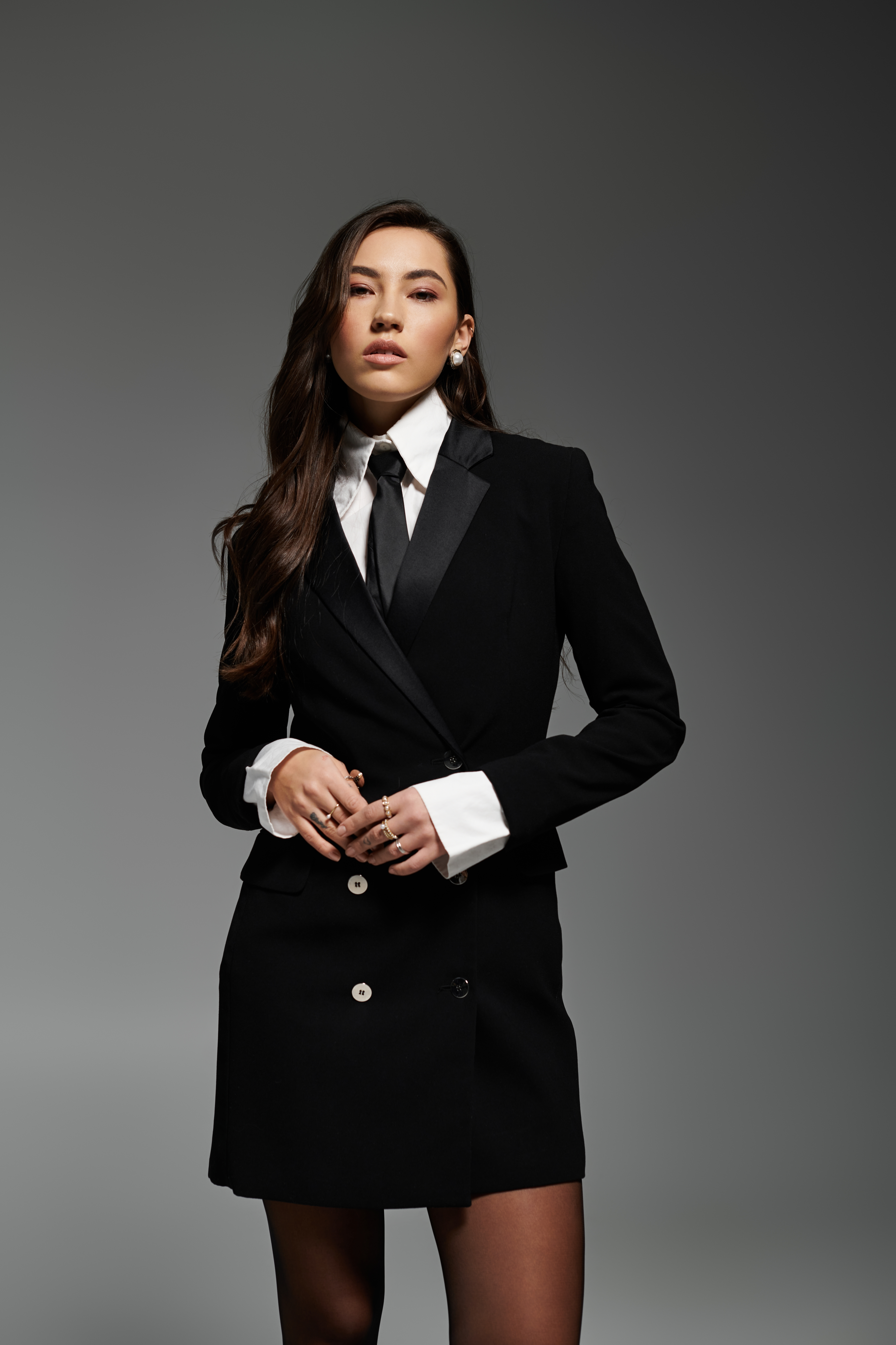A lady wearing an immaculate bespoke tailored suit