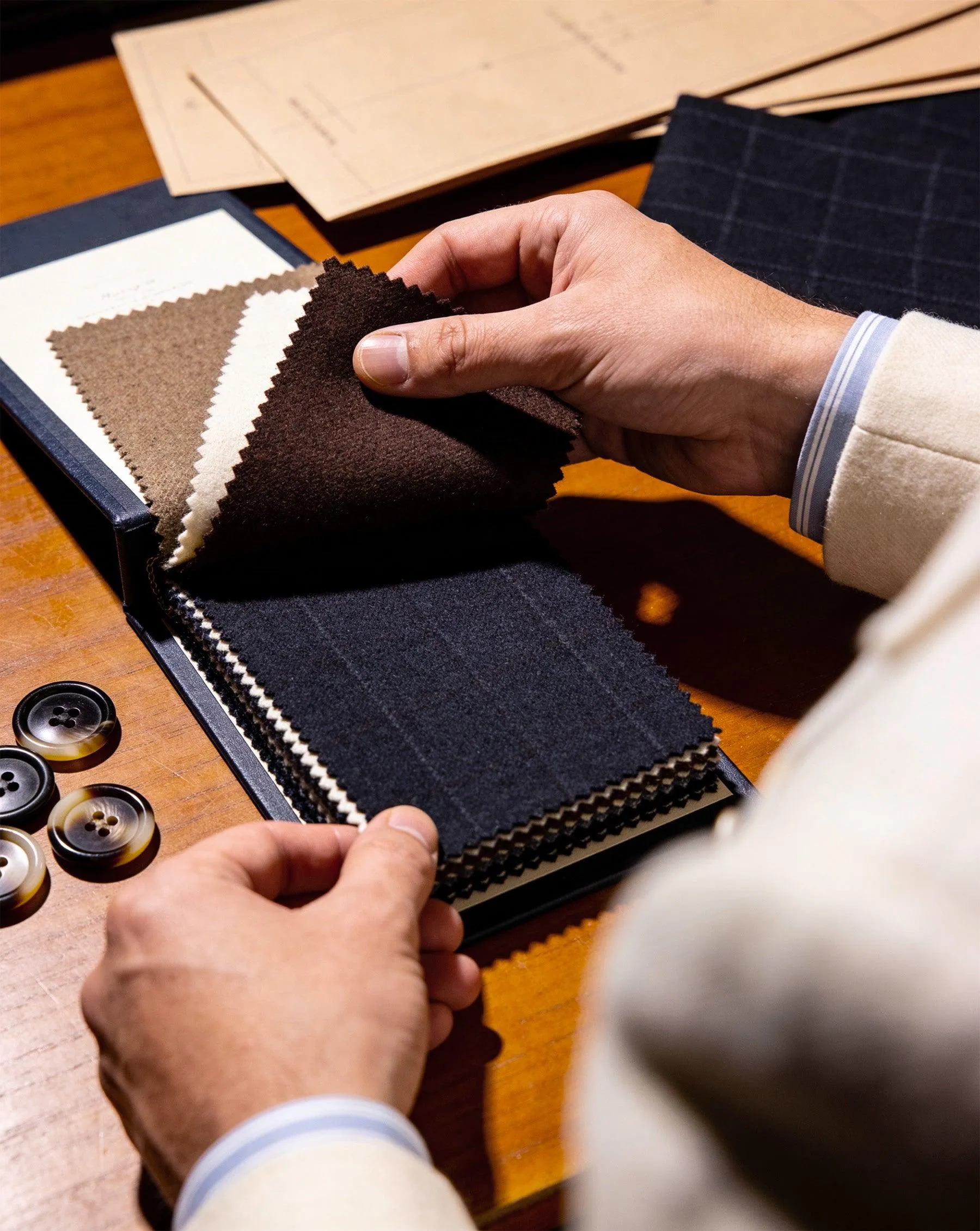 Curated fabric swatches and suiting cloths at Westbury atelier
